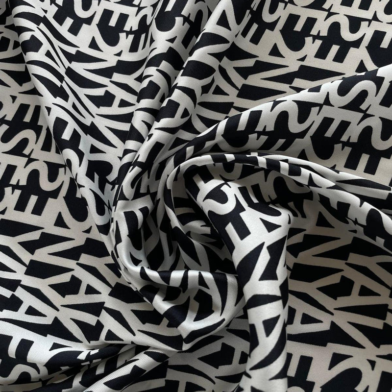 Crepe di Poliestere con Stampa Lettere Diffusione Tessuti Crepe di Poliestere con Stampa Lettere