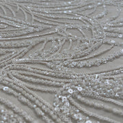 Pizzo Alta Moda perline e paillettes su tulle champagne - Diffusione Tessuti