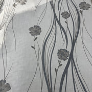 Tenda in poliestere devoré fantasia fiori e steli, altezza 300 cm, orlo piombato, disponibile in due varianti colore.