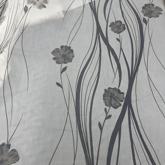 Tenda in poliestere devoré fantasia fiori e steli, altezza 300 cm, orlo piombato, disponibile in due varianti colore.