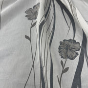 Tenda in poliestere devoré fantasia fiori e steli, altezza 300 cm, orlo piombato, disponibile in due varianti colore.