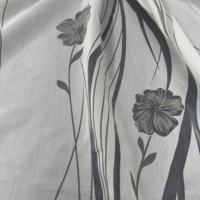 Tenda in poliestere devoré fantasia fiori e steli, altezza 300 cm, orlo piombato, disponibile in due varianti colore.